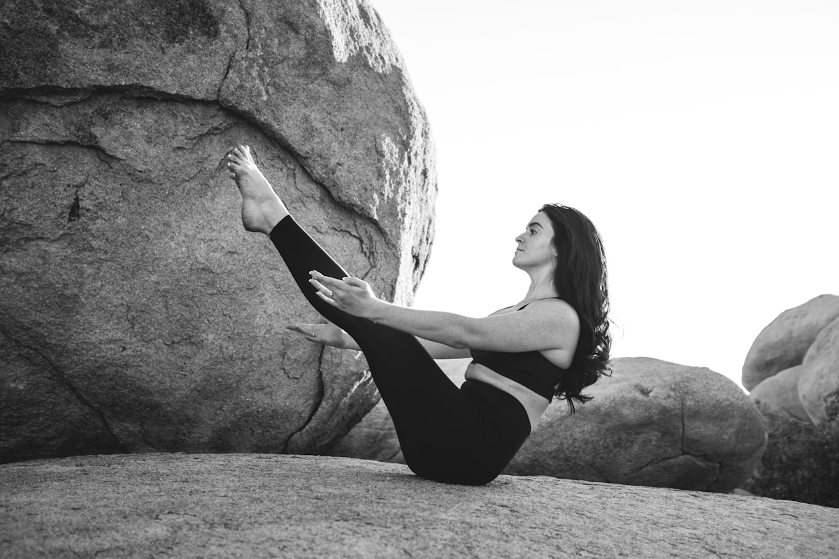 Woman practicing core yoga pose