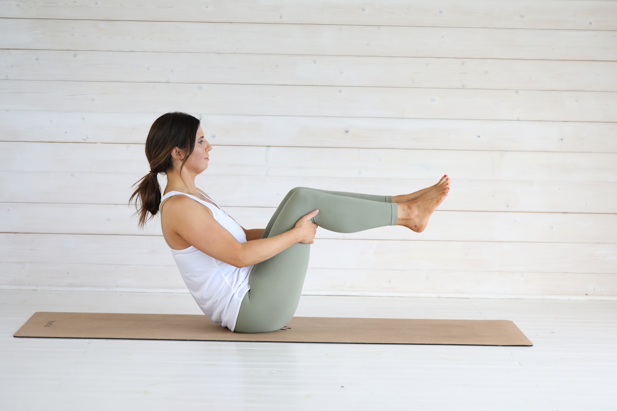 Practitioner demonstrating improved posture and spinal alignment